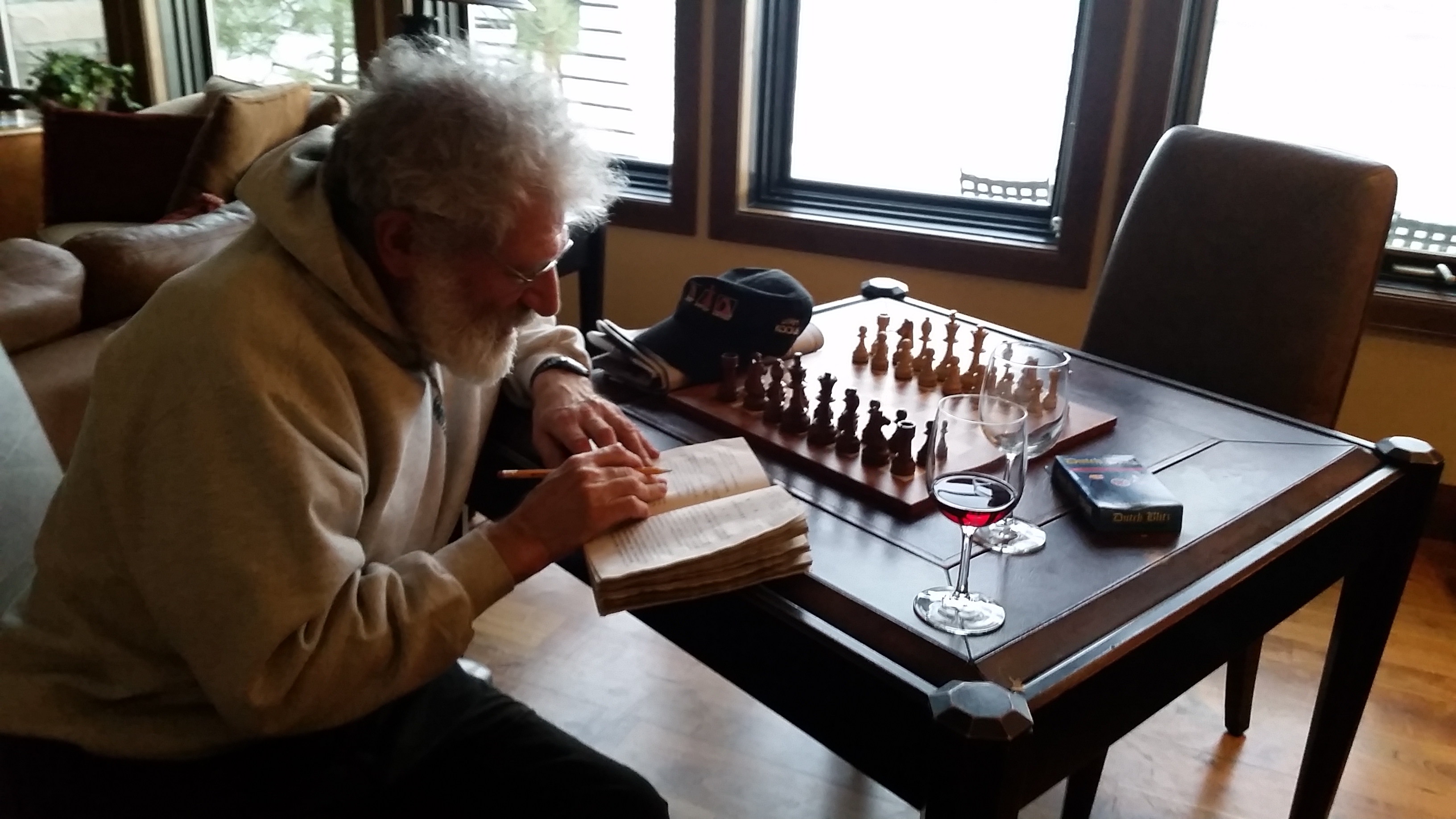 Eric reading next to chess board