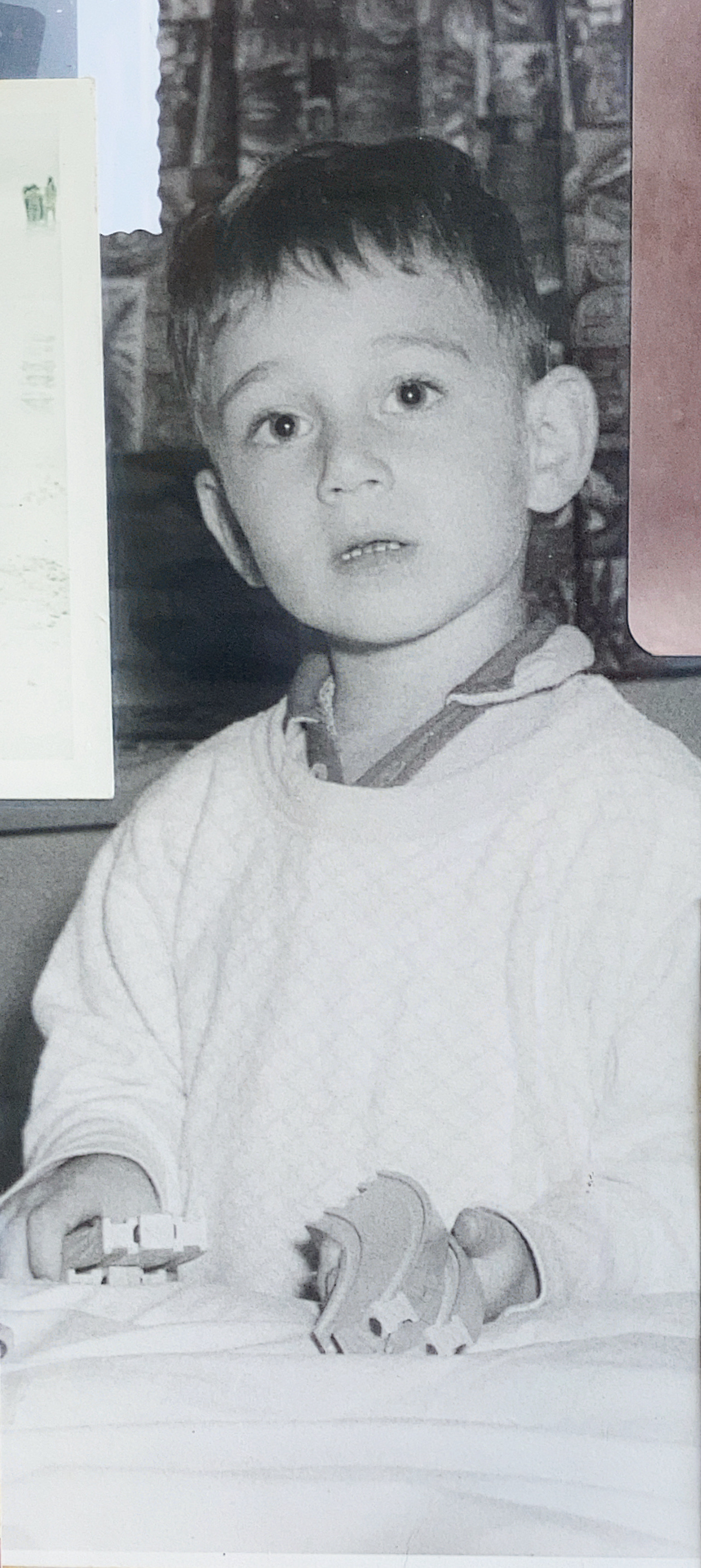 Eric as a kid playing with wooden train track