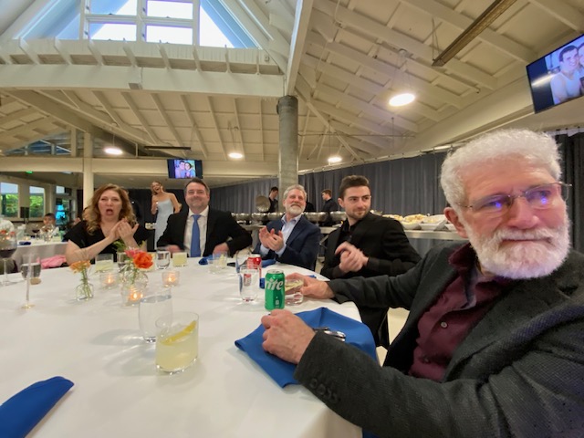 Eric & family seated at the wedding